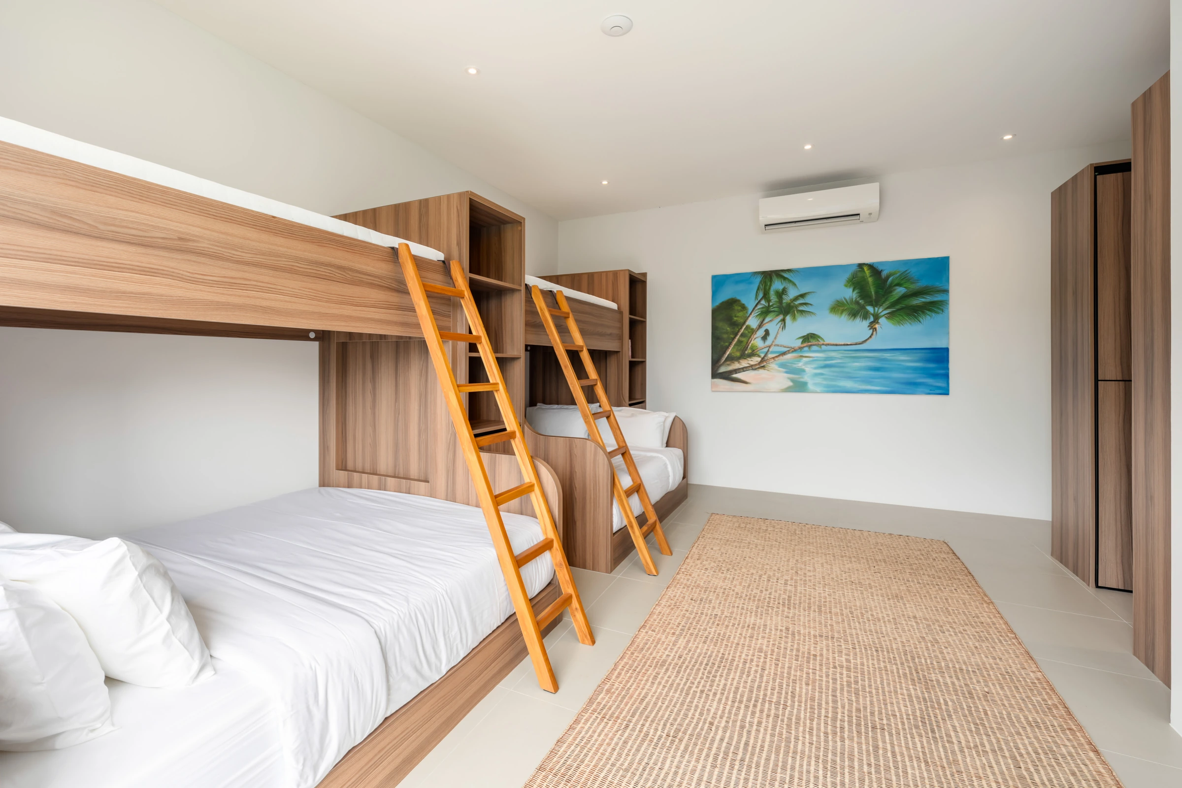 The bunk room with two lower beds and two upper bunks